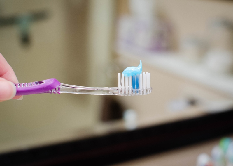 Regular brushing with a fluoridated toothpaste is vital to preventing cavities.